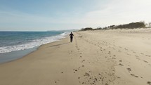 Healthy Person Gets Back Into Physical Shape By Running On The Beach