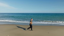 Man Making Sport Training On Sandy Calabrian Beach Near Ocean