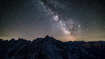 Magic milky way galaxy stars in winter mountains starry night sky Astronomy time-lapse

