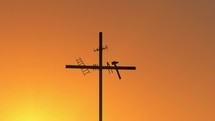 Crucifixes silhouette at sunset light