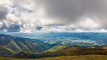Clouds motion fast in fresh spring mountains nature landscape in sunny time lapse
