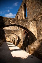 arched walkway at old Spanish Mission