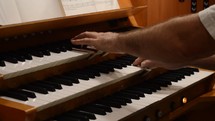 man playing an organ 