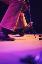 musician's feet stomping to the music