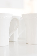 white coffee mugs on a white background 