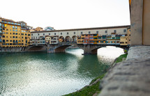 Beautiful view of famous Ponte Vecchio with river Arno at sunset