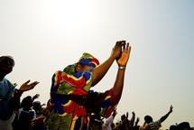 A Nigerian woman worshiping during an open-air service