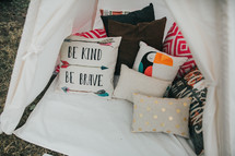 throw pillows in a tent 