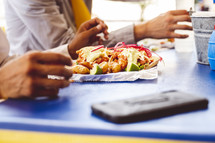 people eating food at a table in Mexico 