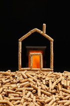Miniature house made with wood pellets