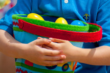 little boy holding an Easter basket