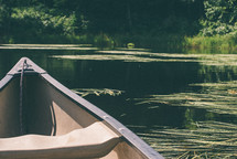 A canoe floating on a river.