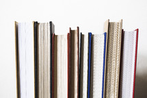 row of books against a white background 