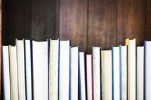 row of books on a shelf 