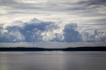 clouds over lake water 