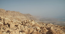 Tracking shot of rocky landscape above the Dead sea in Israel.