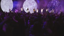 cheering fans at a Christian music concert 