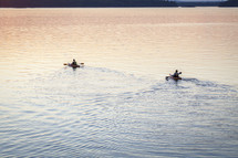 paddling a kayak on a lake 
