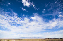 plains and mountains and blue sky