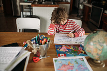 a kid doing school work at home 