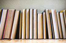 row of books on the floor 