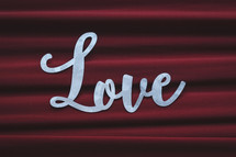 Love on red cloth background