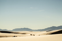 sand dunes and mountain peaks