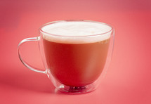 coffee cup on a bright pink background 