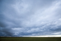 storm clouds over a field 