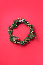 Christmas wreath on a red background