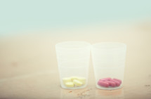 pills in cups 