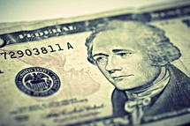 A closeup of a ten dollar bill