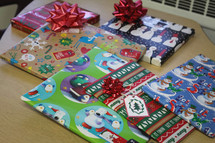 wrapped Christmas gifts on a school table