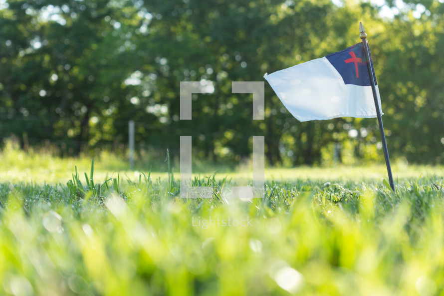 Christian flag in grass