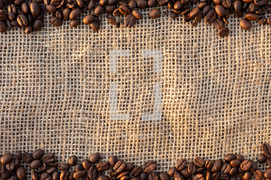 coffee beans border on burlap 