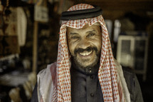 Middle Eastern man smiling at the camera