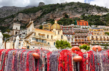 Fishing nets on the beach of Positano, Italy and view of church dome