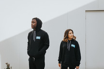 young people in hoodies encouraging other's to vote 