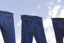jeans hanging on a clothesline 