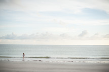 girl child walking on a beach
