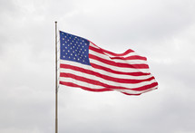American Flag with a  Cloudy Sky