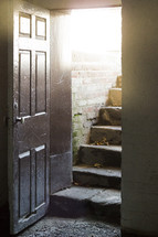 sunlight on steps to a cellar 