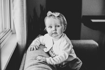 portrait of toddler girl on a couch 