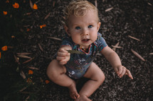 toddler girl holding a leaf 