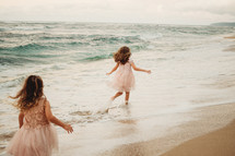 girls running in the tide 