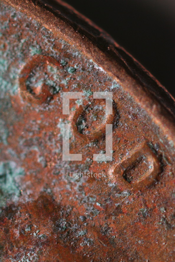 macro rusty penny - word God 