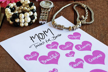 mother's day card, and jewelry on a table 