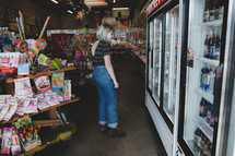a woman shopping at a candy shop 