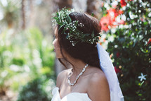 a bride with a crown of flowers in her hair 