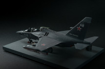RUSSIA / YAK-130 - 2019. Miniature of military fighter on a black background with place for text